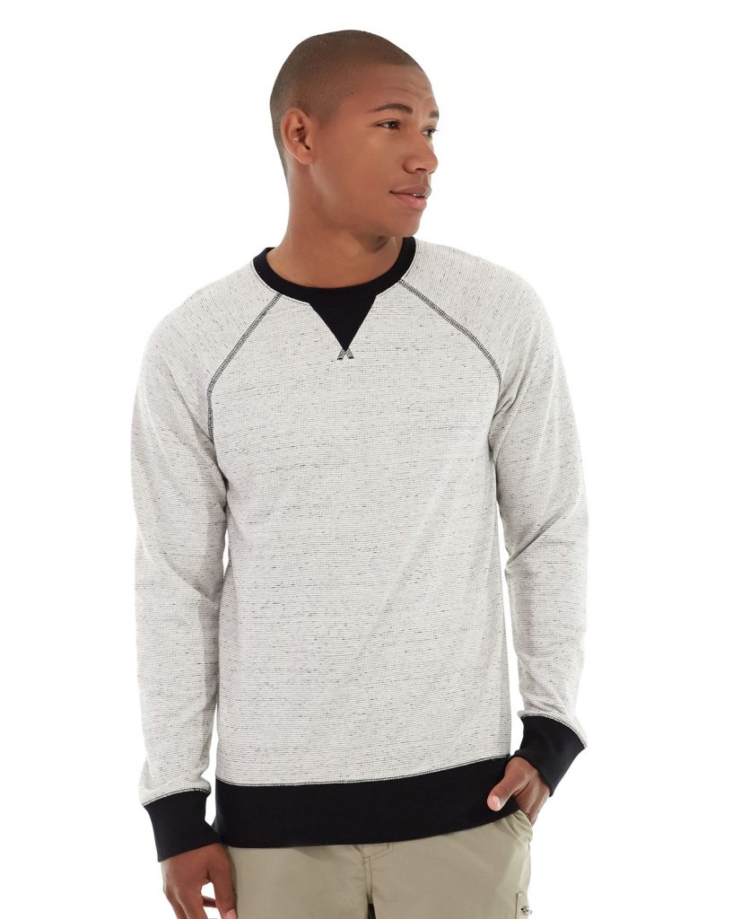Male model wearing heather gray crewneck sweatshirt against minimalist background