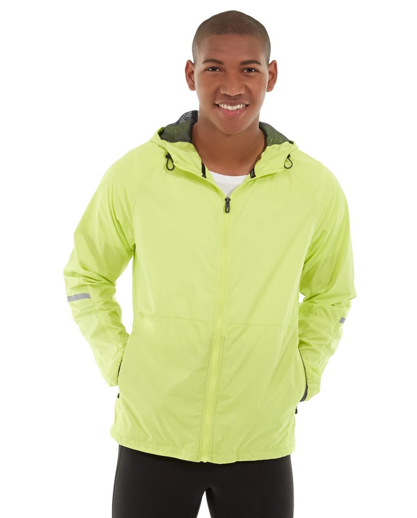 Outdoor jacket with reversible design in windy mountain landscape