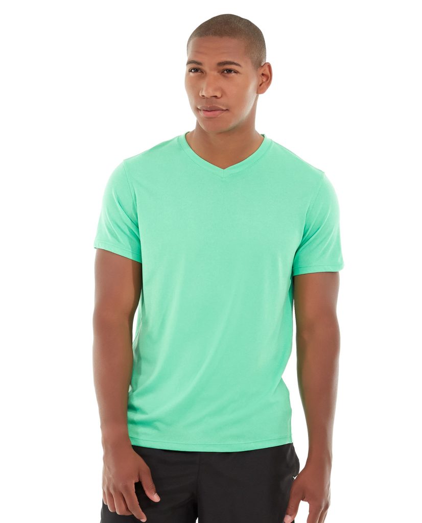 Athletic runner wearing a lime heathered v-neck performance shirt mid-stride on a trail