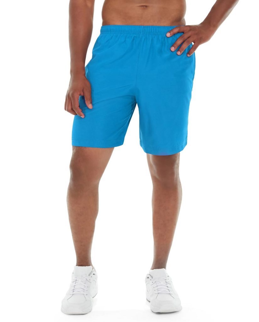 Athletic model wearing blue Meteor Workout Shorts, mid-motion during exercise routine
