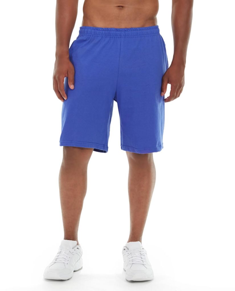 A man wearing navy blue gym shorts, mid-stride during a workout